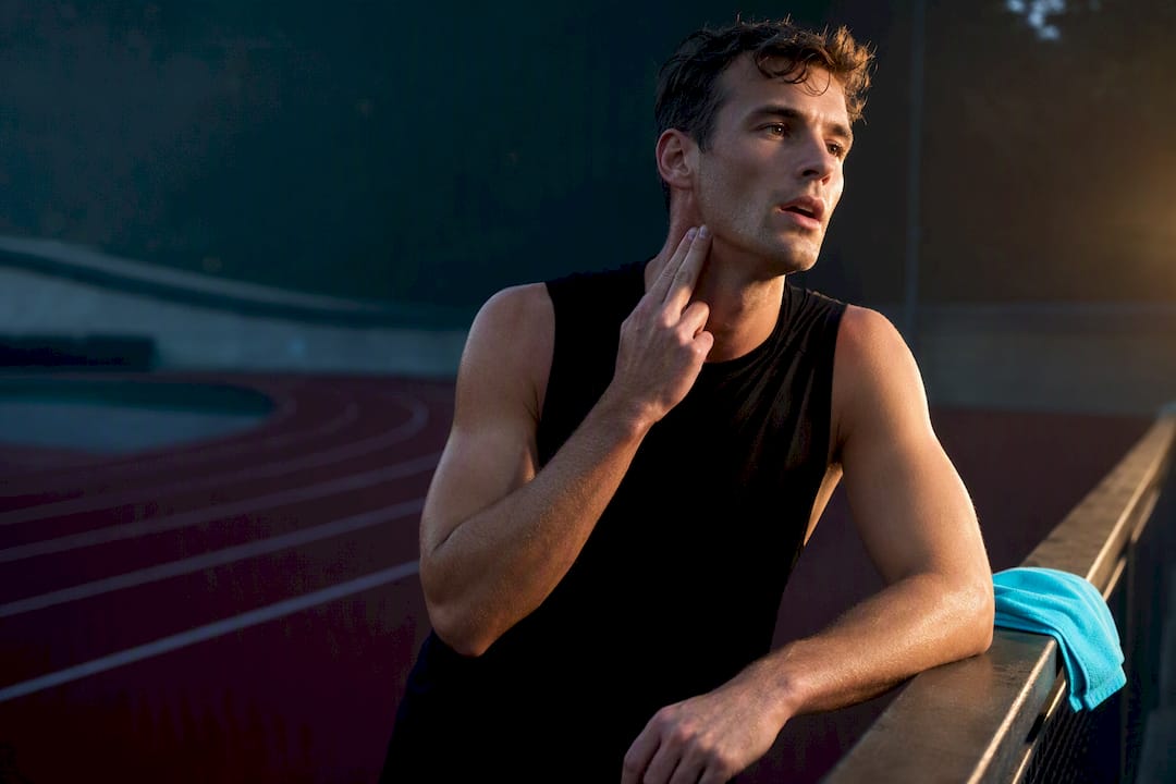 Runner checking pulse after interval training