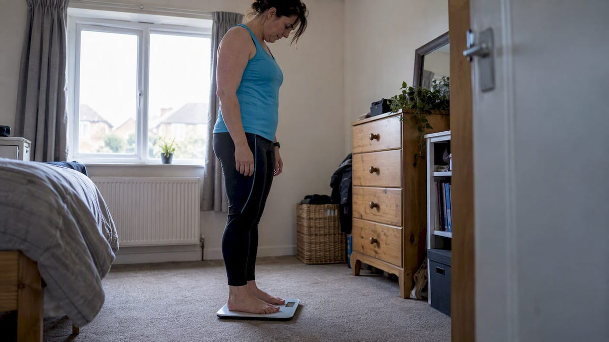 Person using a body composition scale