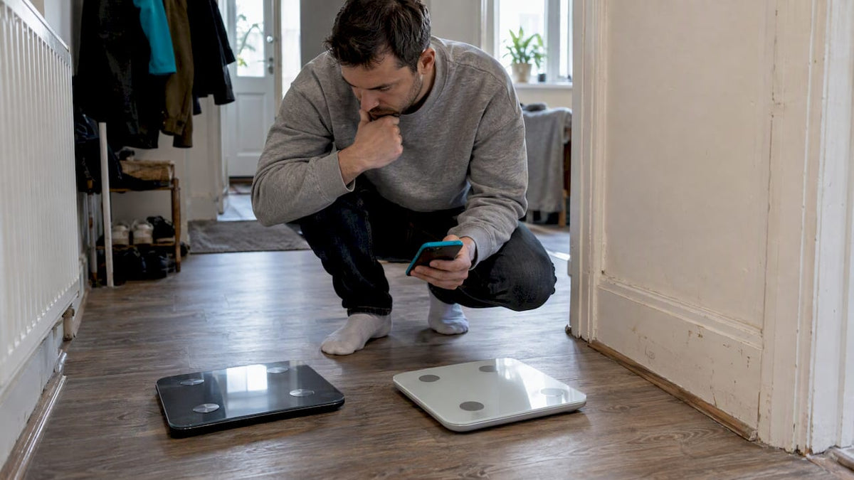 Buyer comparing smart scales by app