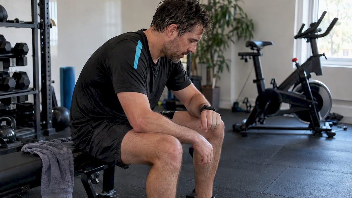 Runner measuring heart rate after exercise